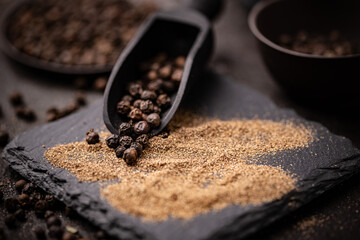 Black pepper scoop on slate